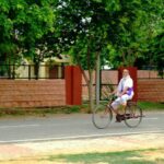 A devotee riding a bicycle peacefully at Vrindavan (U.P.)