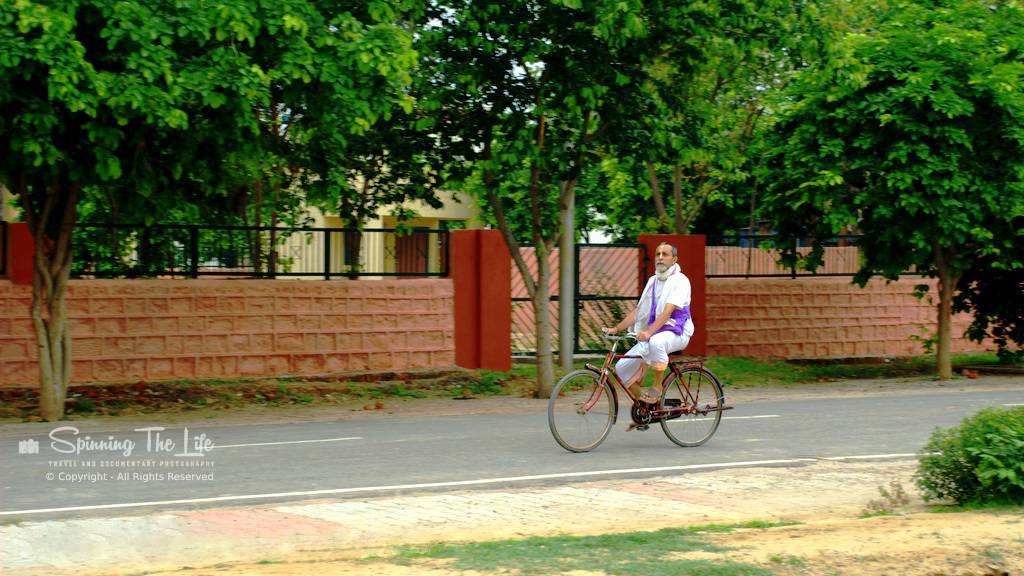 You are currently viewing A devotee riding a bicycle peacefully at Vrindavan (U.P.)